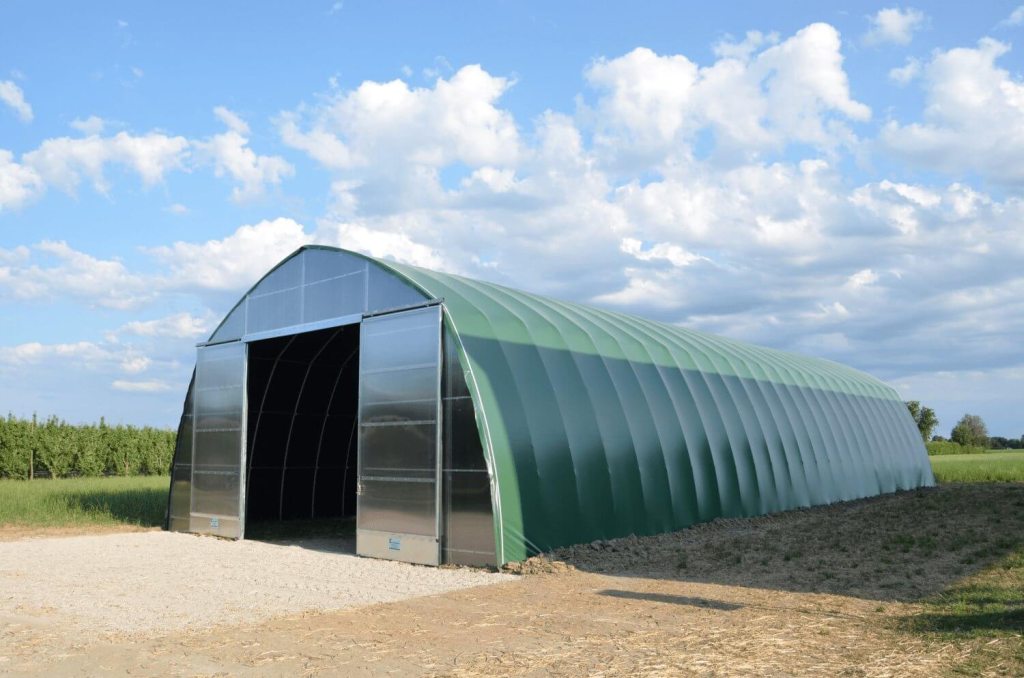 Greenhouse-based storage tunnel covered with green plastic
